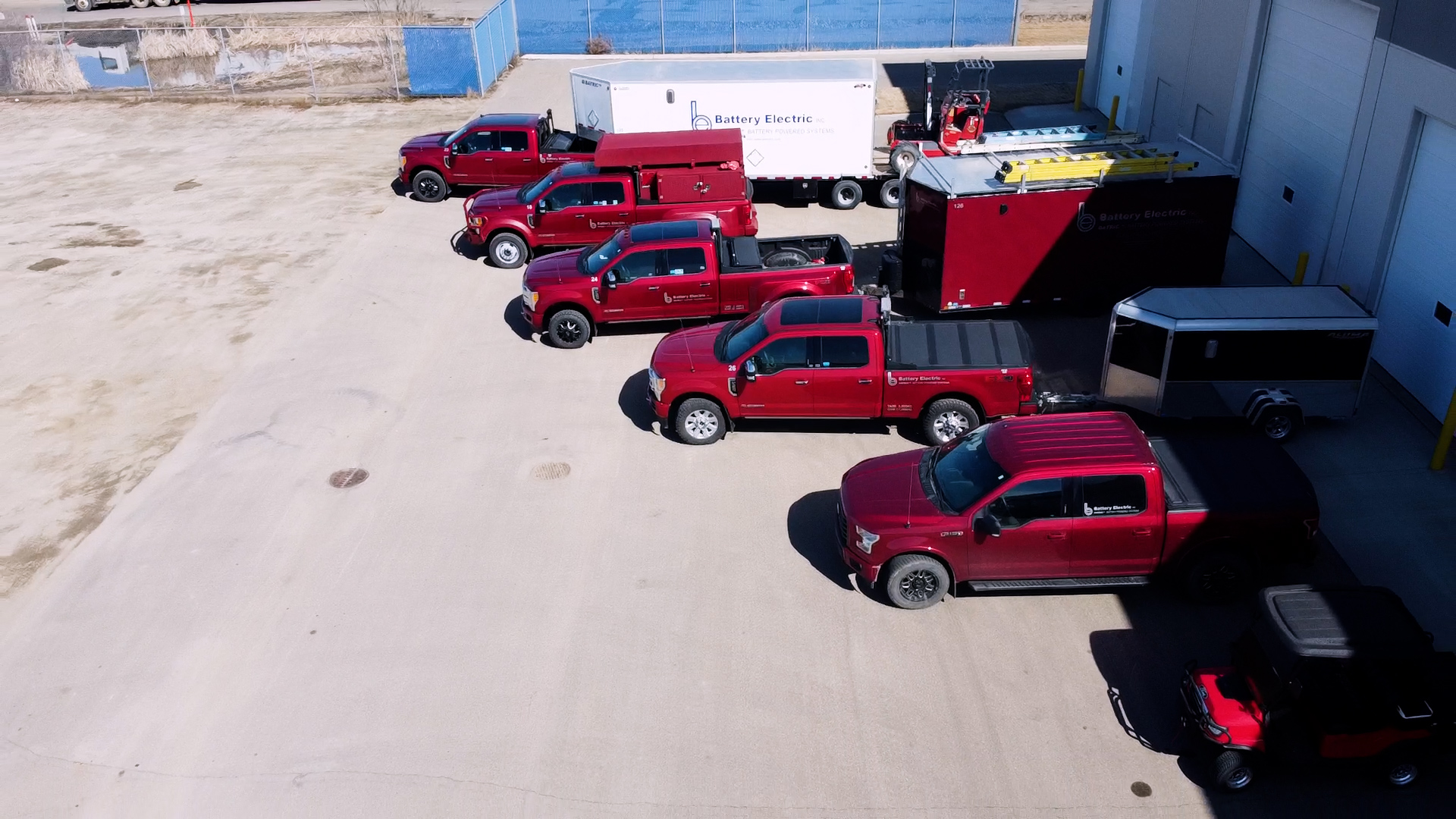 battery electric trucks with trailers outside